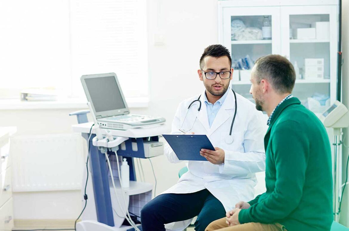 Ambulatory surgery center doctor talking to a male patient