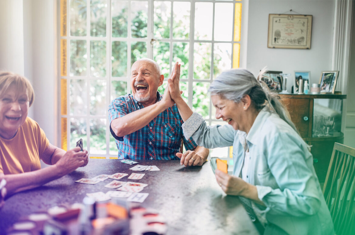 Image of residential assisted living tenants playing cards